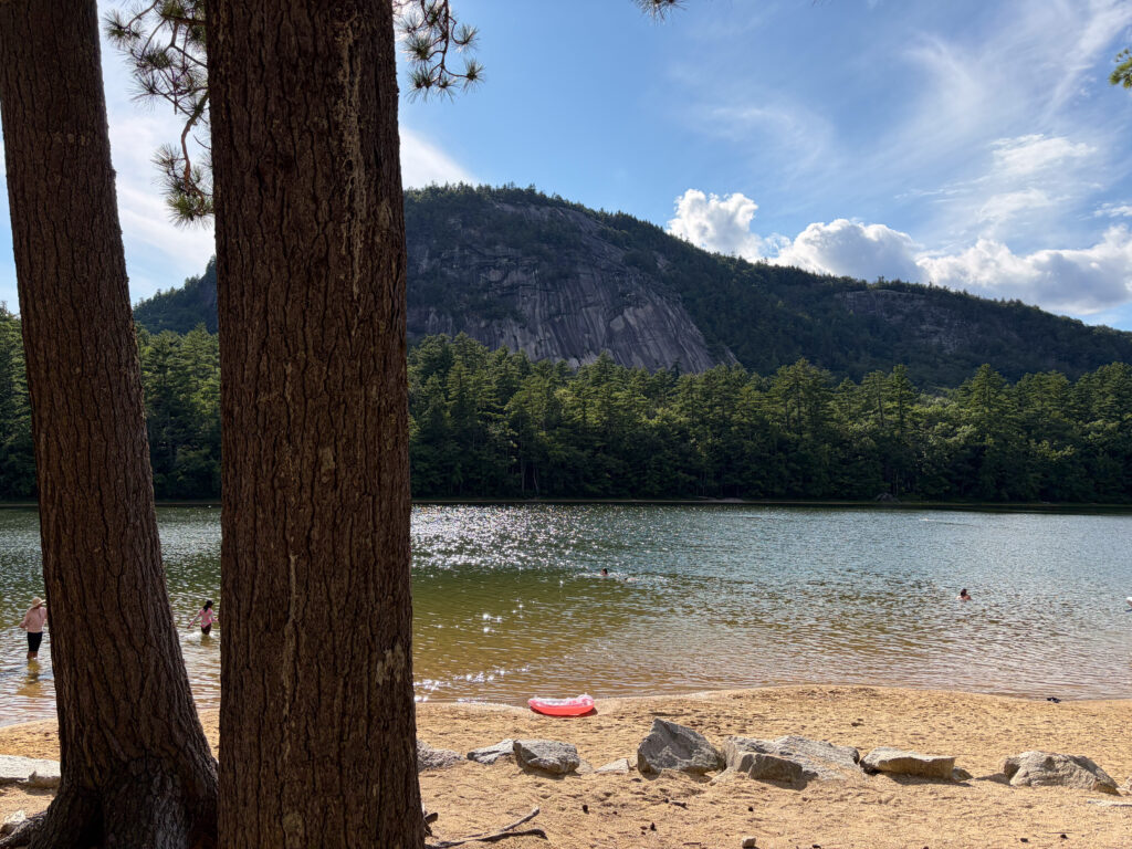 Echo Lake at Echo Lake State Park in North Conway, New Hampshire, surrounded by forest and mountains.